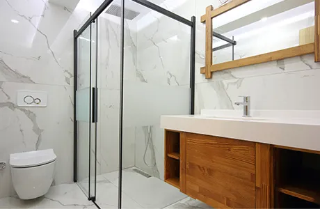bathroom with framed glass shower.